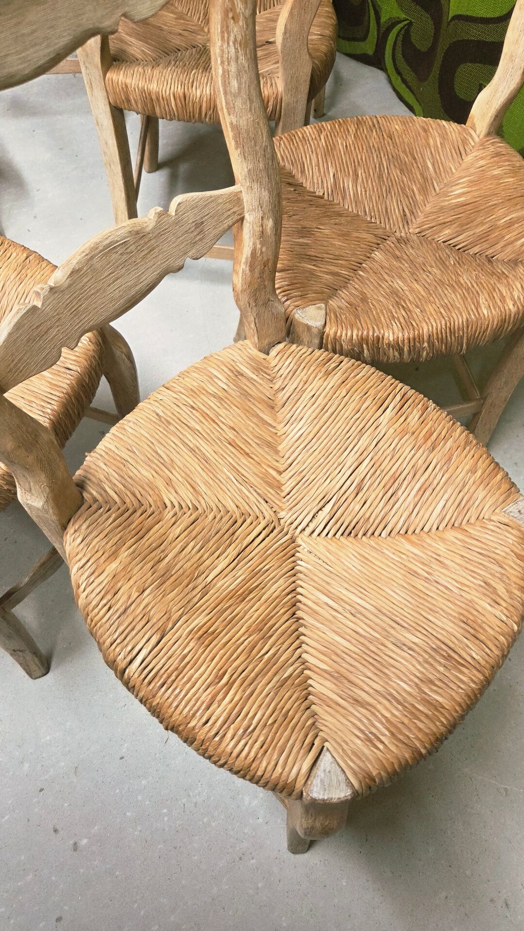 8 rustic oak chairs with patina, straw seating, 1950s.