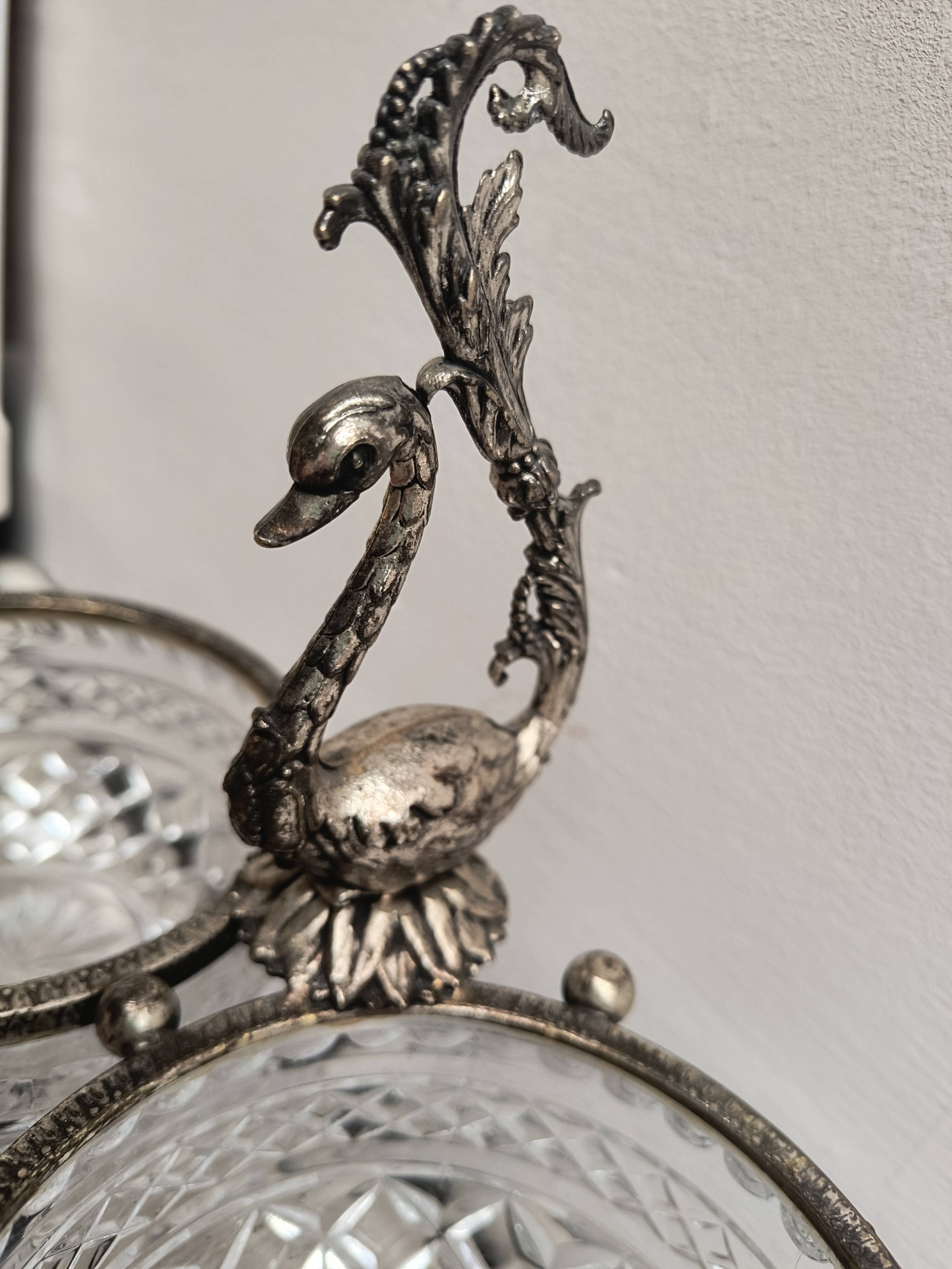 Crystal bowls joined by "swan neck" creation.