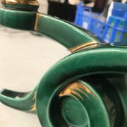 Art Deco candlestick in green and gold earthenware.