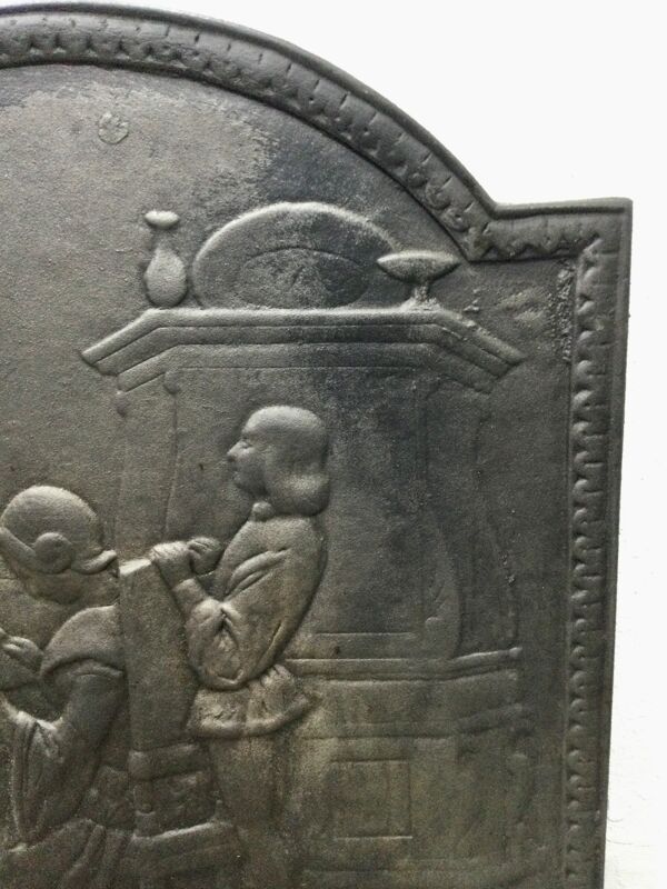 Plaque de cheminée « liseuse devant le feu »