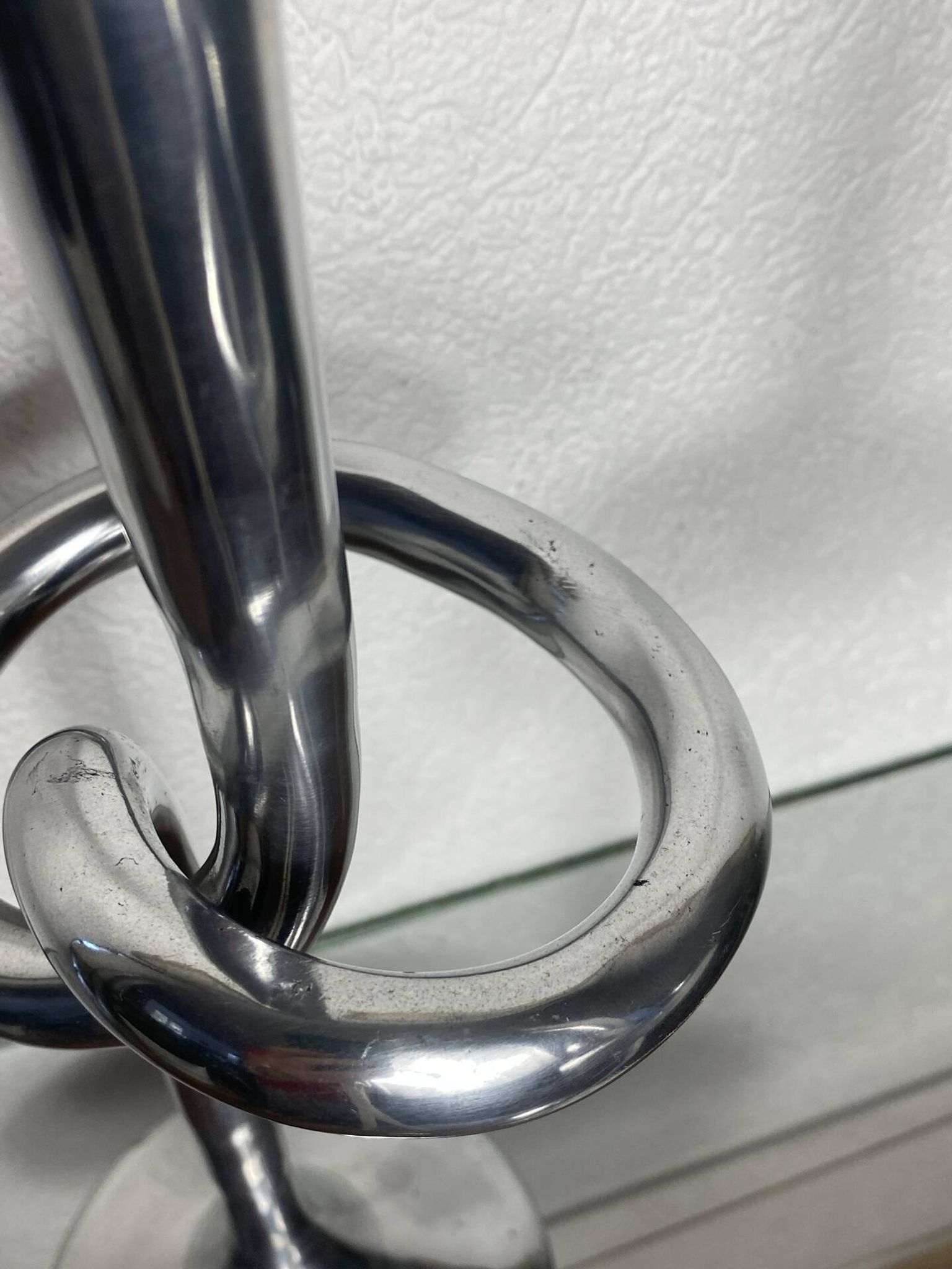 Pair of large aluminium bow candlesticks, Italy, 1970.