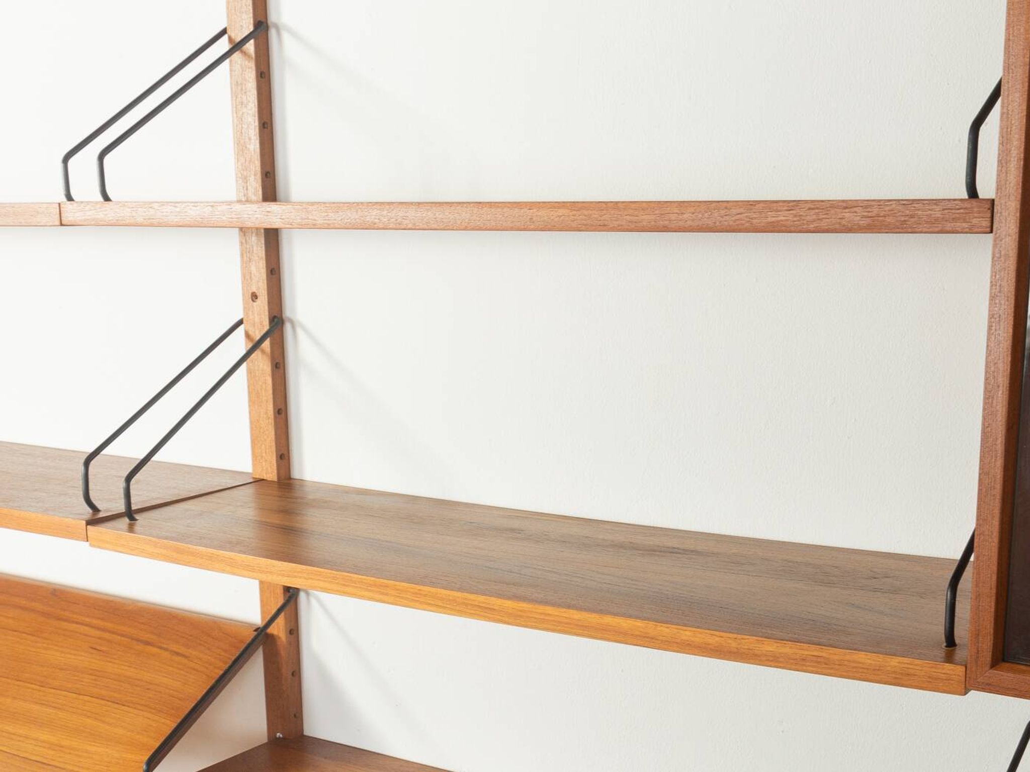 Classic shelving system from the 1960s in teak veneer by Poul Cadovius for Cado
