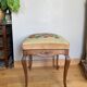 19th century Regency footrest with floral bouquet tapestry made with cross stitch