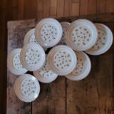 11 dinner plates decorated with stylized roses. 1950s. 11 dinner plates