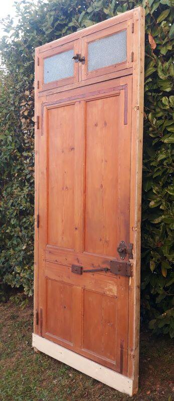 Front door and its frame, translucent glass windows, early 20th century