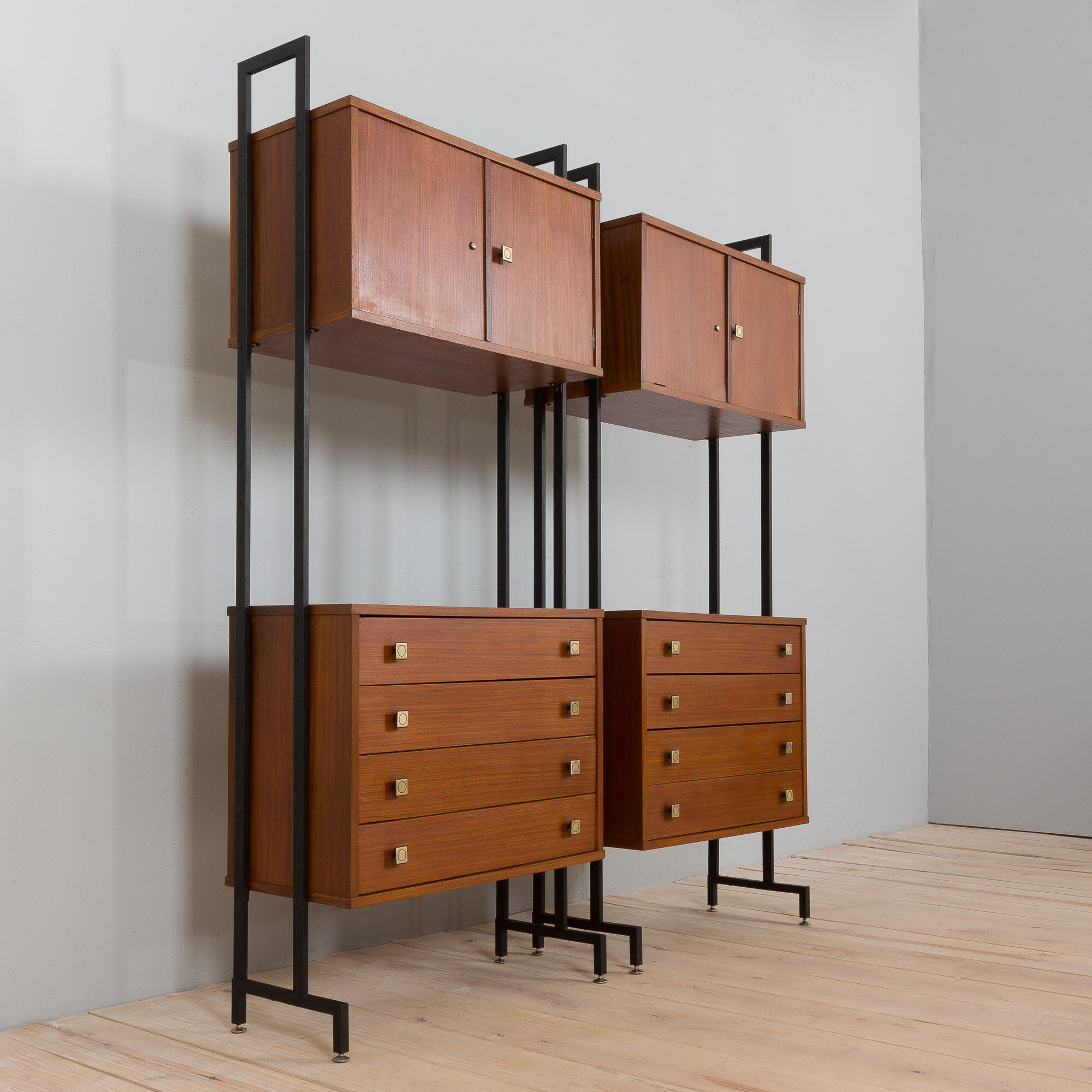 Pair of Italian mid century freestanding wall units in teak with brass handles.