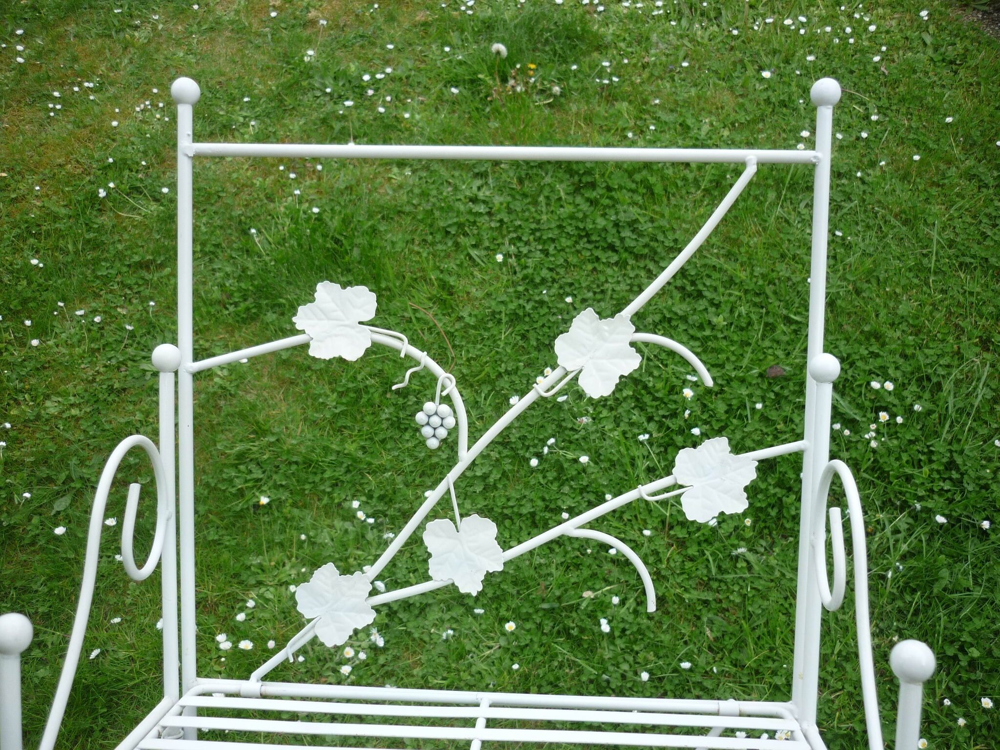 Folding white wrought iron shelf