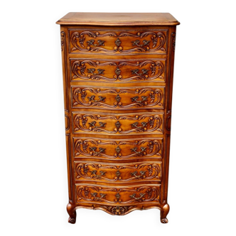 Seven-drawer chest of drawers with Louis XV style engraving.