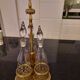 3 crystal decanters diamond cut set of 3 crystal decanters in a gold gold support,