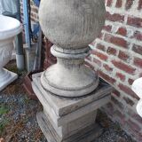 Ball on base in gray patinated reconstituted stone