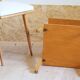 Bedside or side table with compass legs.