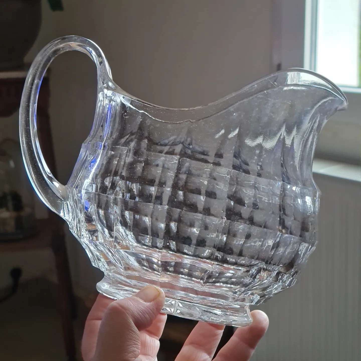 Faceted antique glass pitcher
