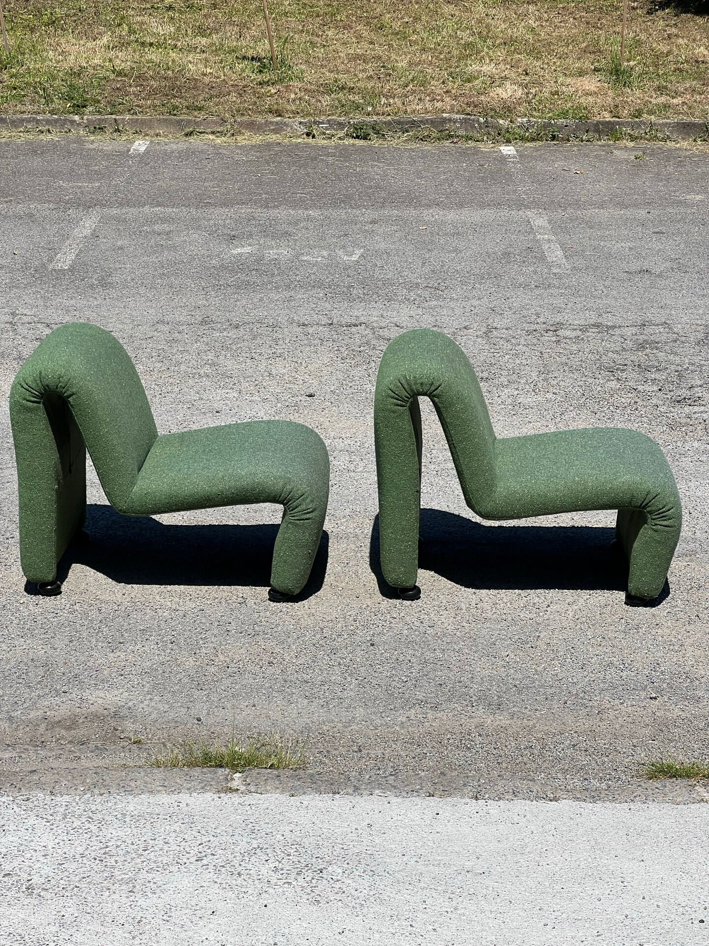 Green armchairs designed by Étienne Fermigier