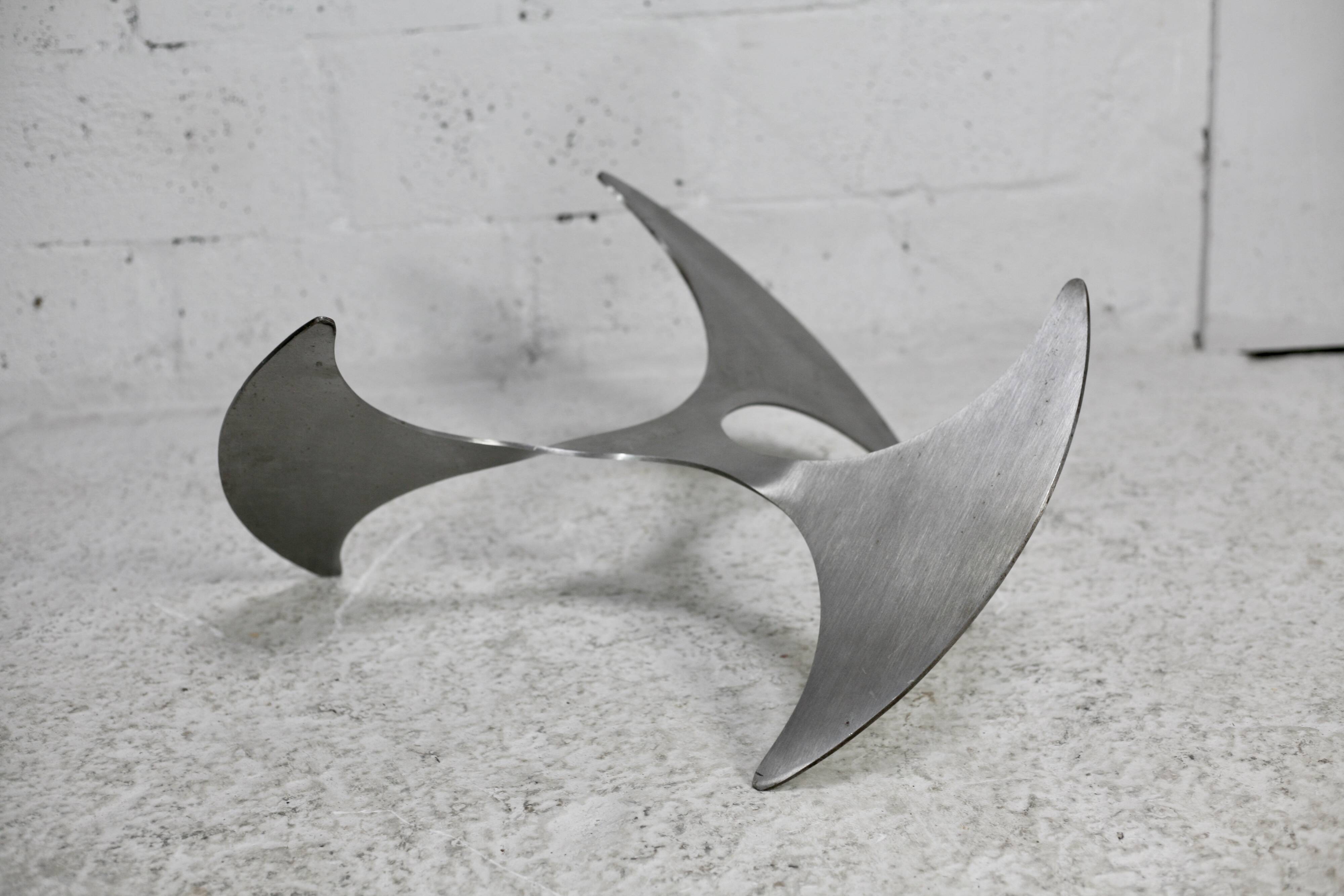 "space age" coffee table. Steel legs, glass slab. Circa 1970