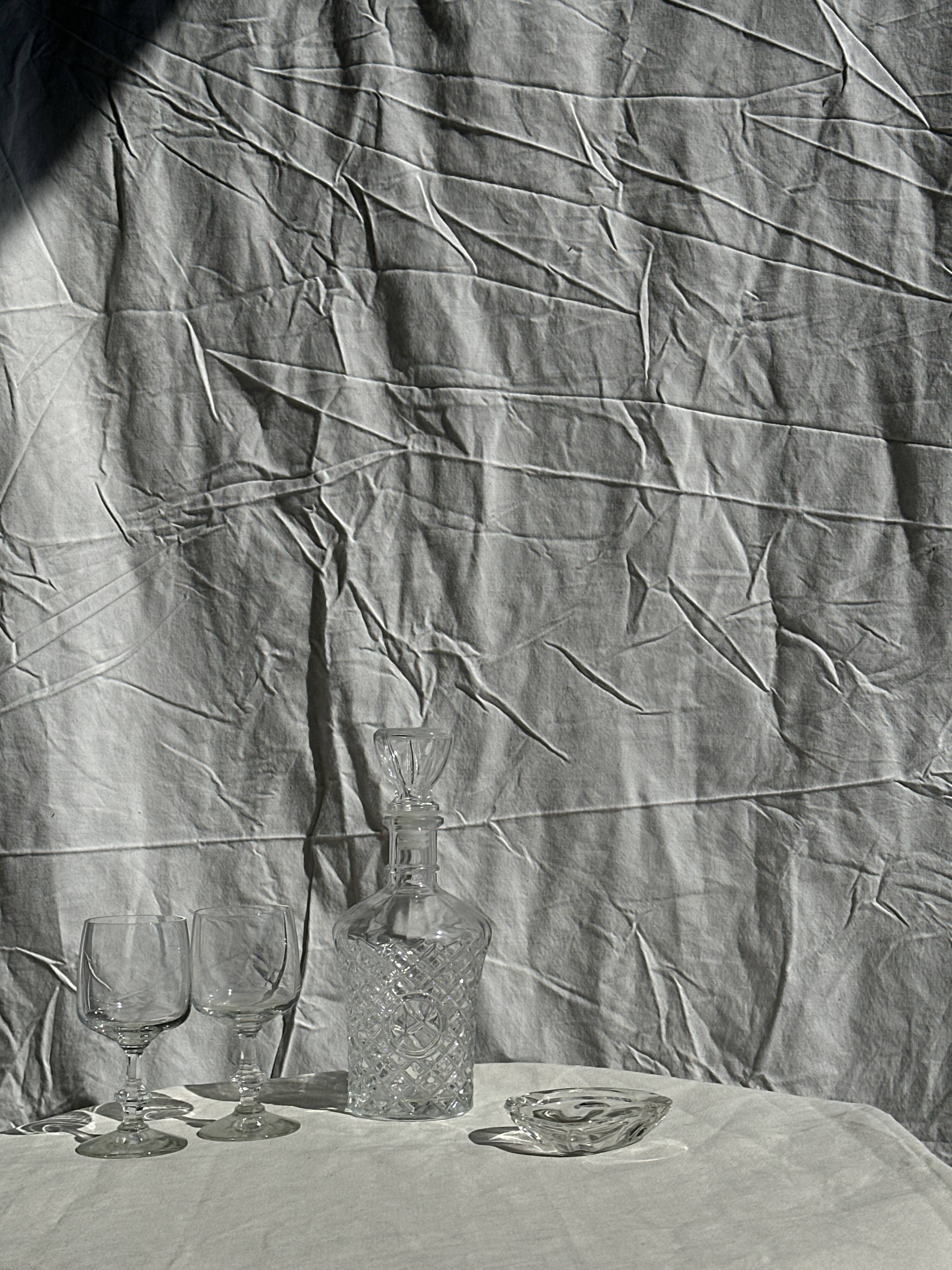 Small cylindrical glass whiskey decanter H:23