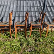 Set of four wooden bistro chairs, green seat, mid-20th century.