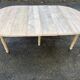 Renovated Louis Philippe round extendable dining table with 4 leaves.