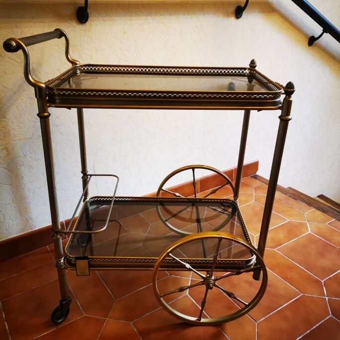Golden metal serving trolley