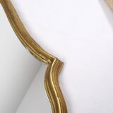 Old wooden mirror gilded with gold leaf