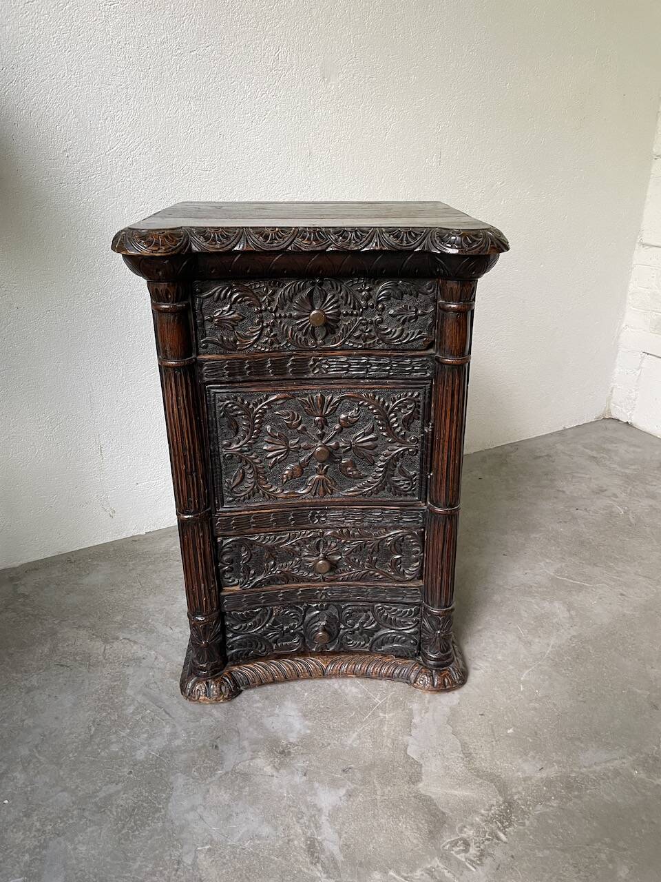 19th century chest of drawers in carved blackened pine