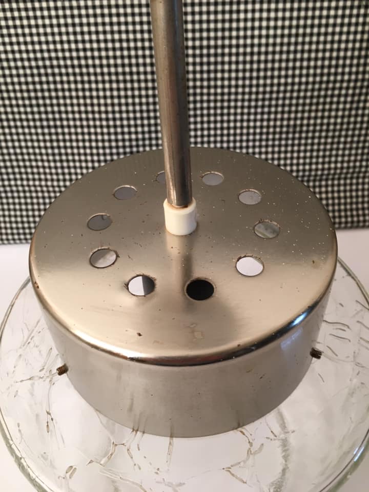 Vintage pendant light with laminated effect glass globe and chrome attachment