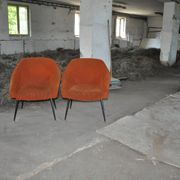 Pair of Mid-Century armchairs in black metal and orange fabric, VEB Sitzmöbelwerke, 1960s.