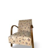 Ensemble de fauteuils Art Déco avec accoudoirs en hêtre arqués.