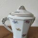 Antique porcelain sugar bowl with a decagonal base.