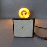 Post-Modern lamp in black metal and gilded brass.