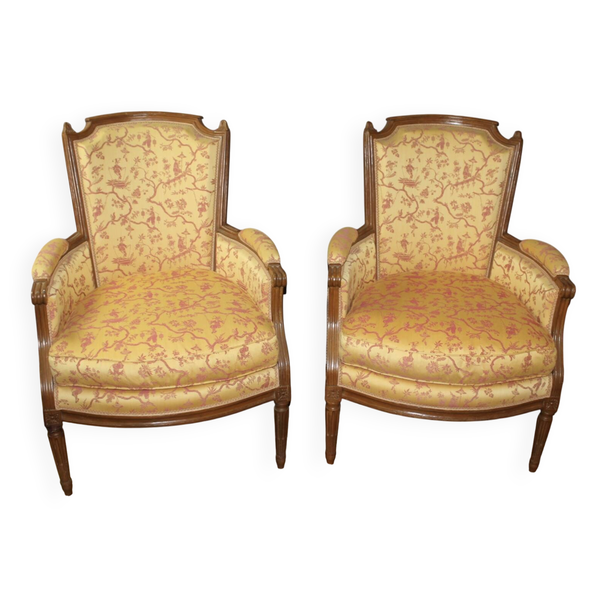 Pair of Louis XVI Bergères in walnut, late 18th century.