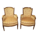 Pair of Louis XVI Bergères in walnut, late 18th century.