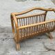 Magazine rack in braided rattan of the 60s