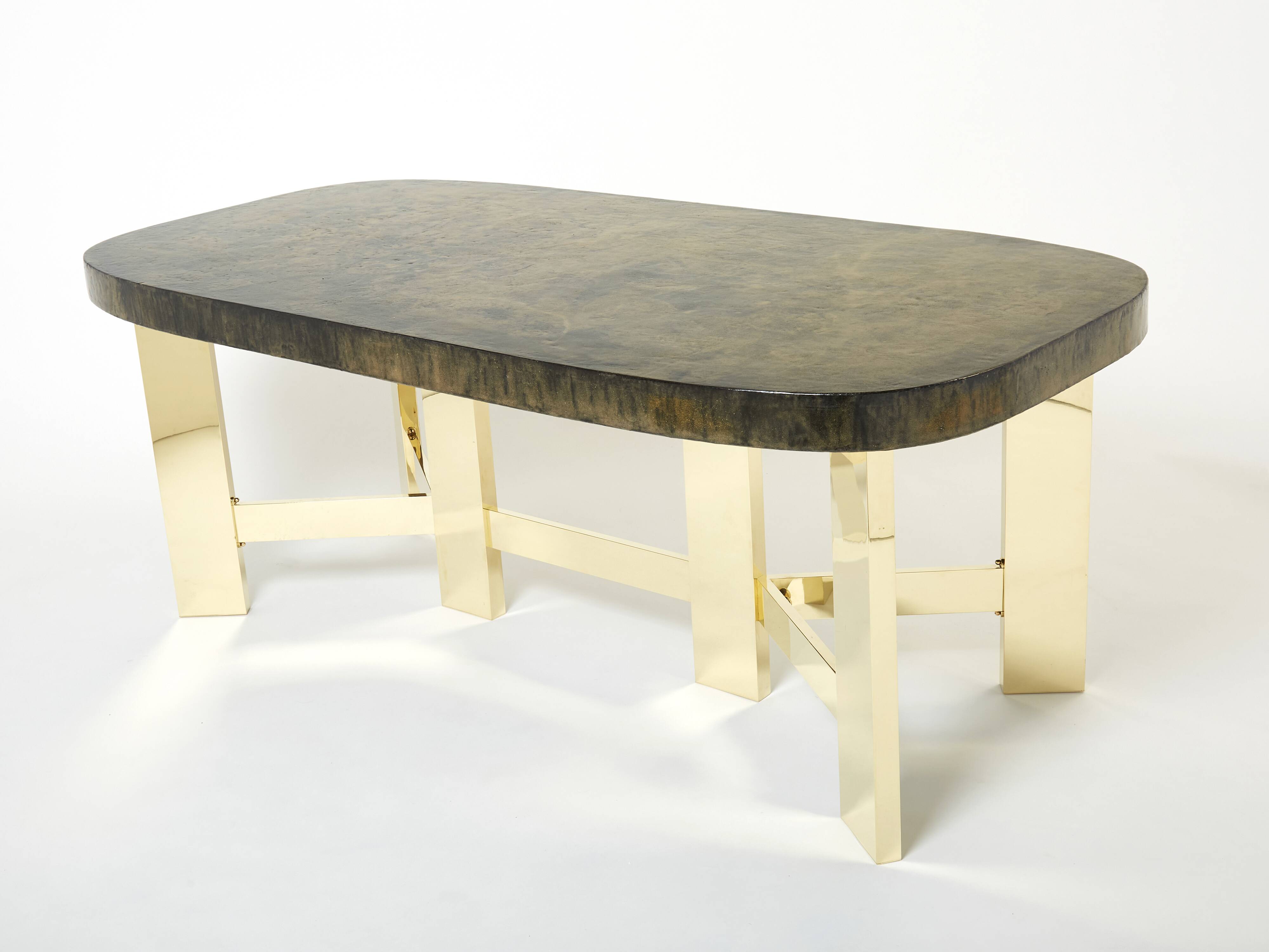 Brutalist Belgian dining table in resin and brass from around 1970.