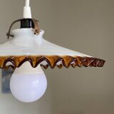 Old pendant light with a white opaline glass shade and a wavy border.