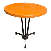 Vintage bistro table with black cast iron base and orange bakelite top, 1950s