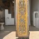Rectangular Indonesian construction element with blue and yellow plant in carved wood