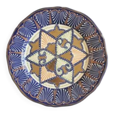 Decorative plate in glazed earthenware HB Quimper with ethnic patterns.