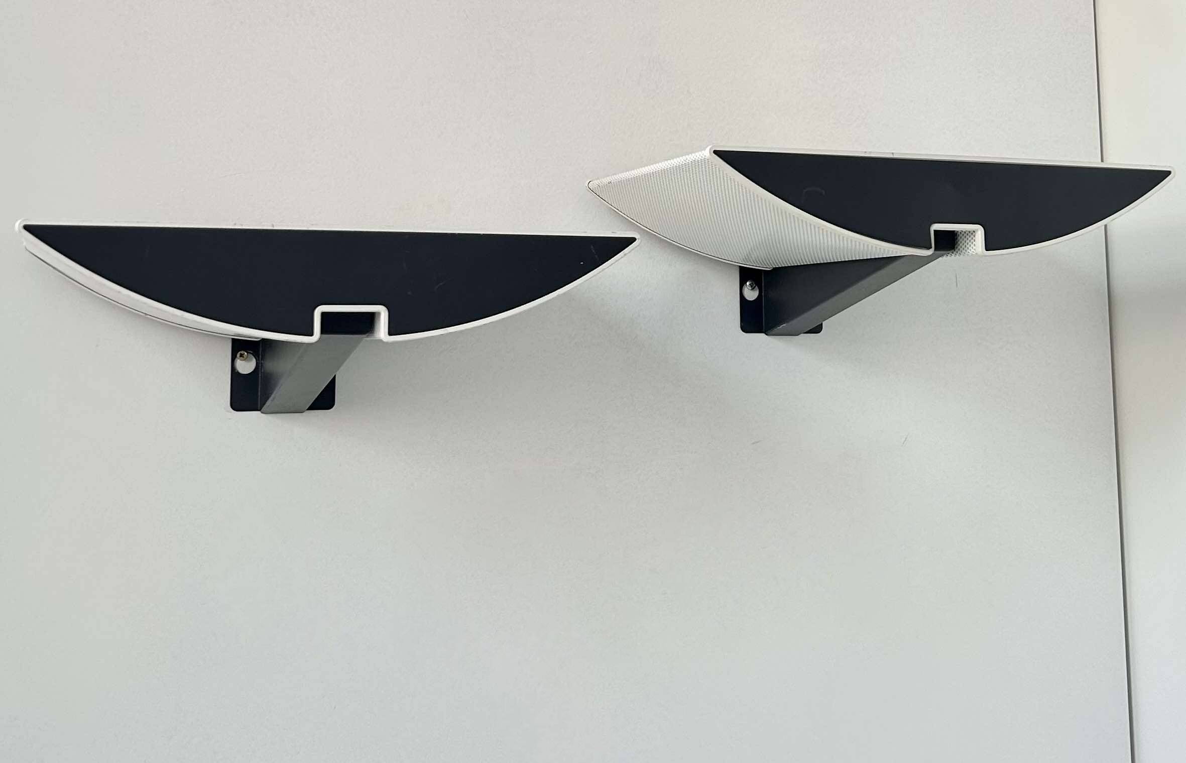 Pair of modernist wall lights, black and white lacquered metal, Italy 1980