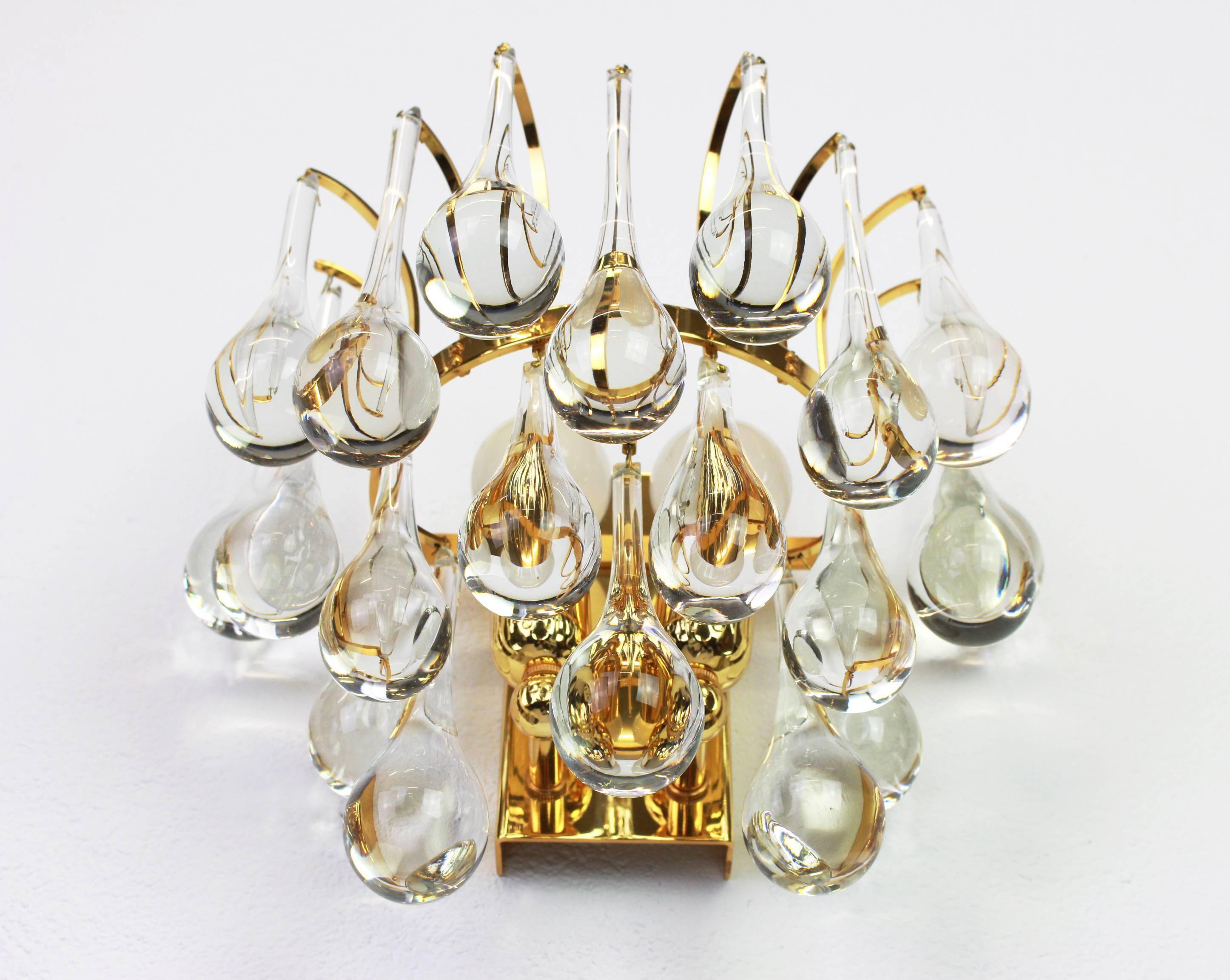 Large pair of gilt brass and crystal wall lights by Palwa, Germany, 1970s.