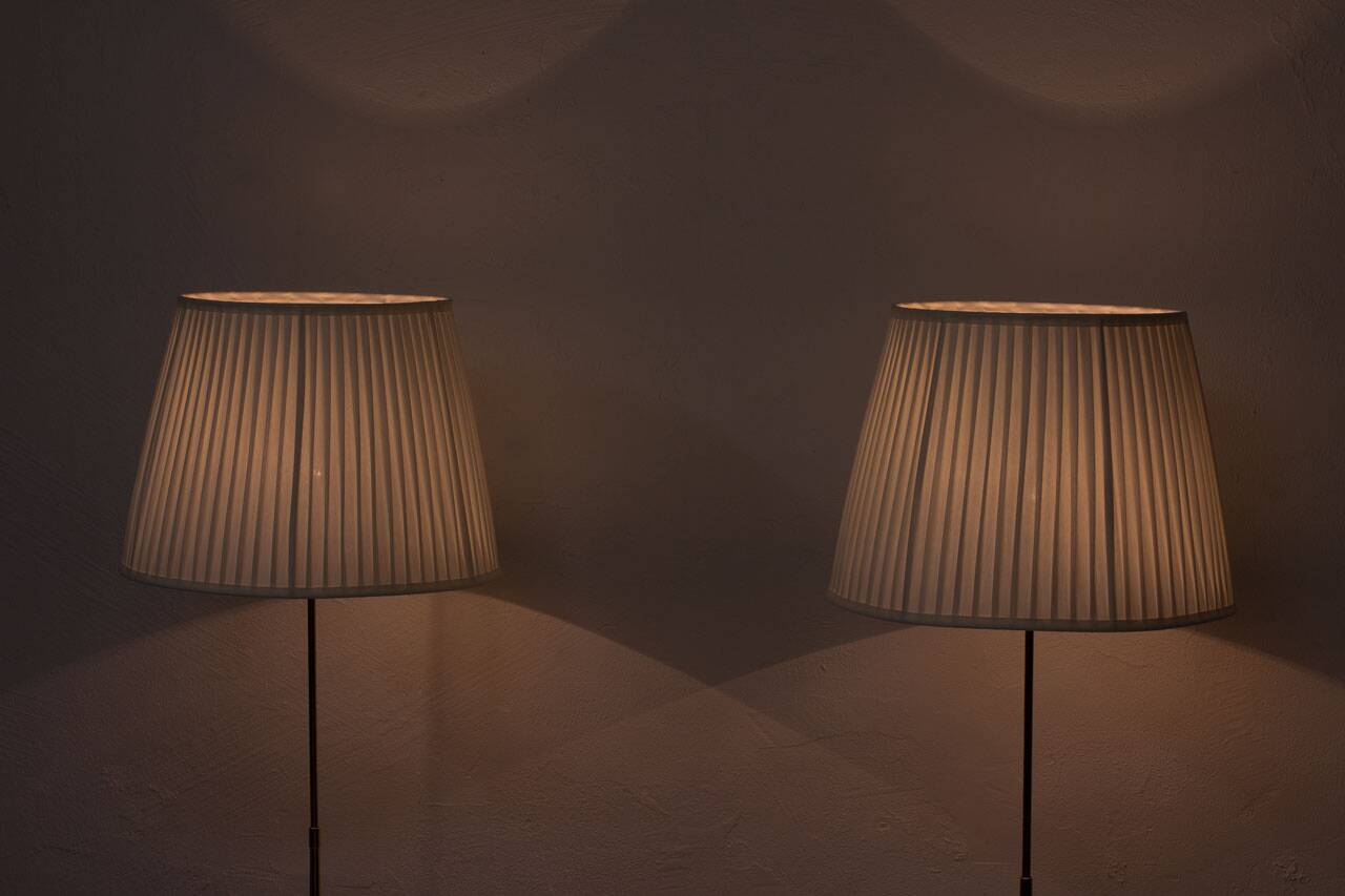 Pair of brass floor lamps by ASEA Belysning, Sweden, 1950s