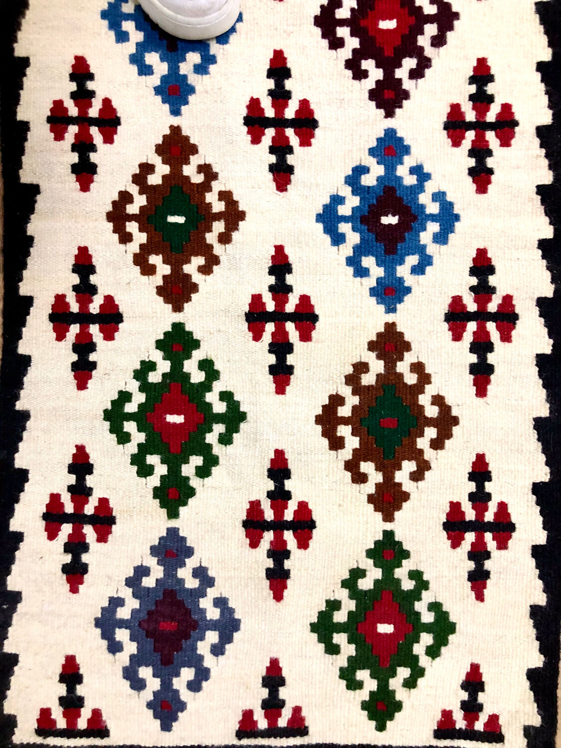 Small ethnic carpet