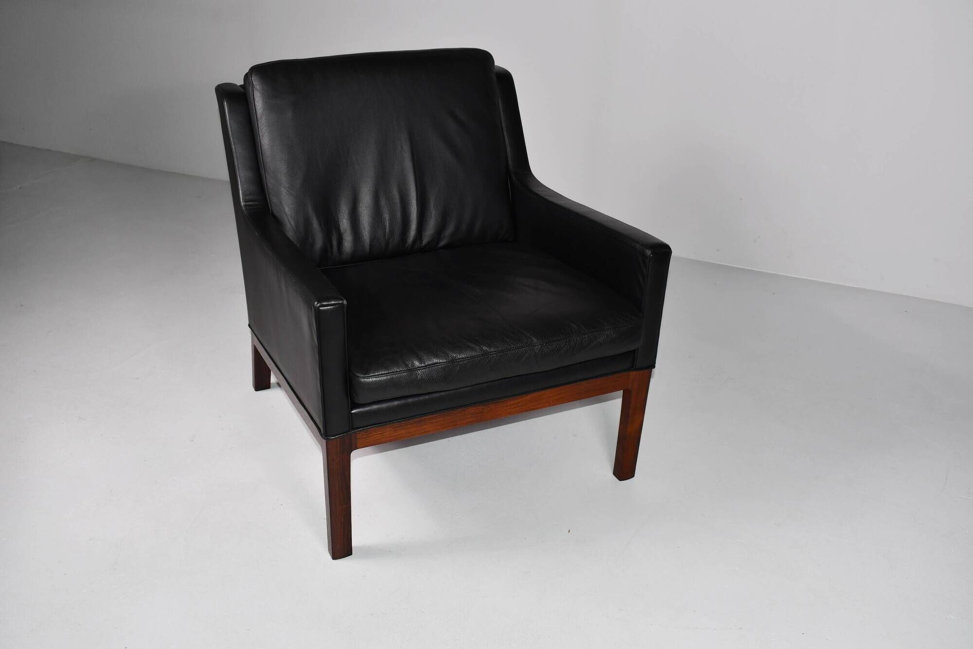 Leather and rosewood armchair by Kai lyngfeldt-Larsen. Denmark