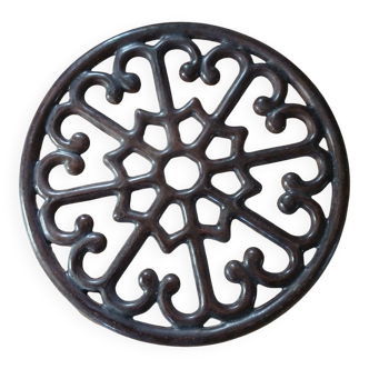 Brown cast iron trivet