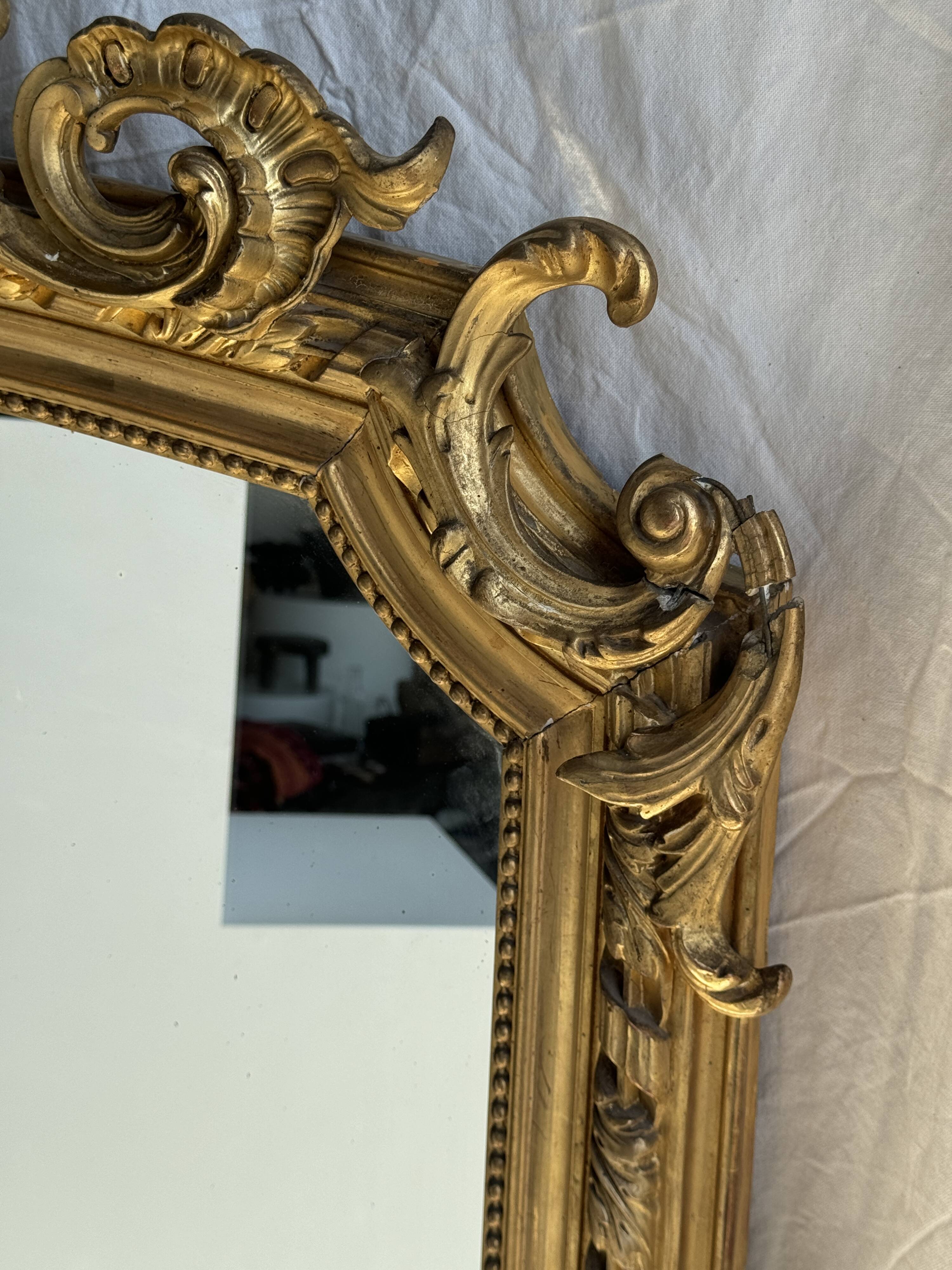 Large gilded mirror with acanthus leaf pediment H150 L98