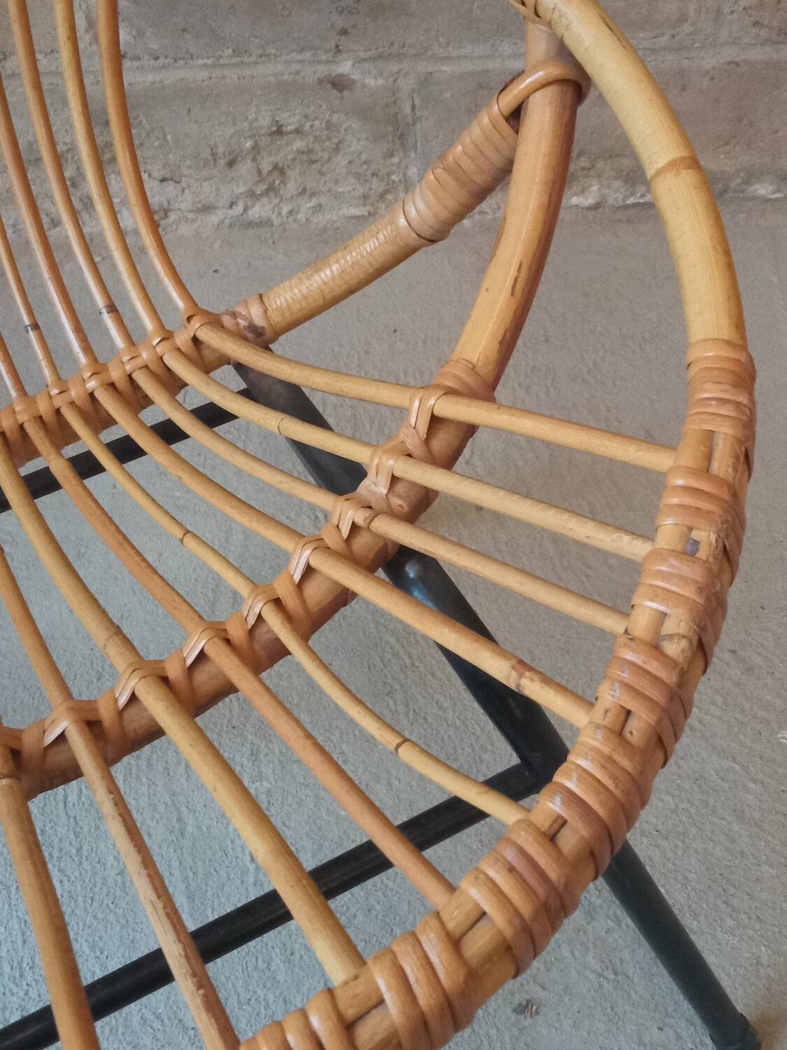 Rattan armchair with metal base from the 1950s