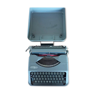 Vintage typewriter / old portable Hermès Baby