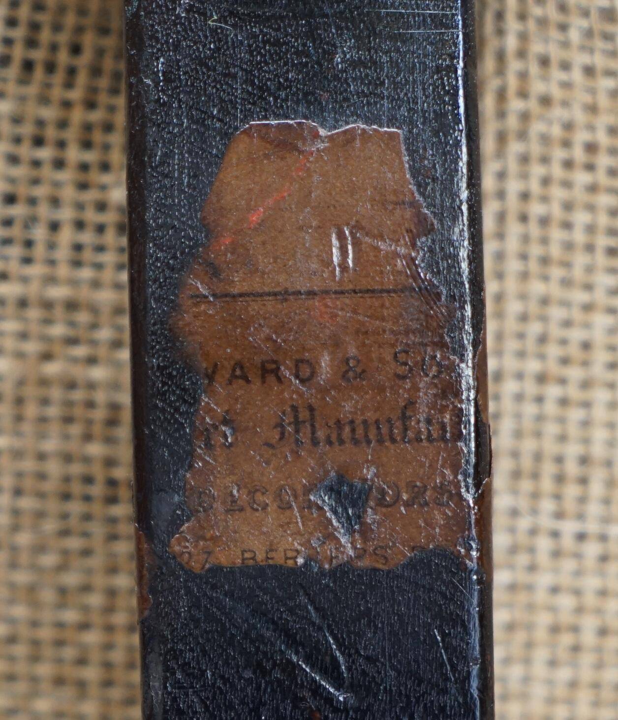 Pair of leather Chesterfield sofas by Howard & Sons