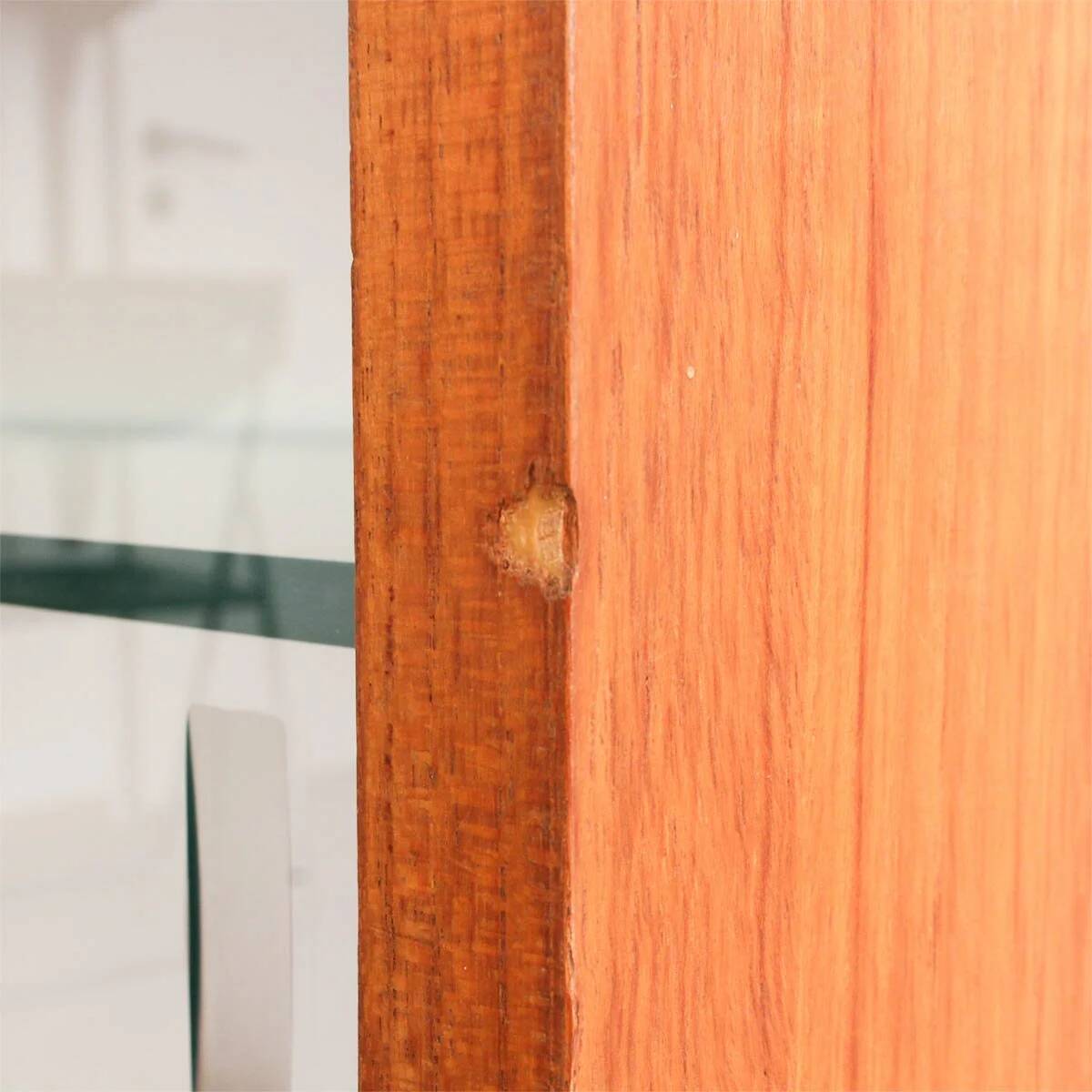 Teak display cabinet with black hairpin legs.