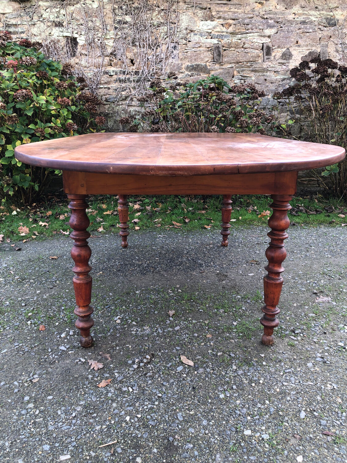 Antique cherry wood farmhouse table with rounded ends