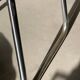 Pair of green vinyl and chrome armchairs, mid-century